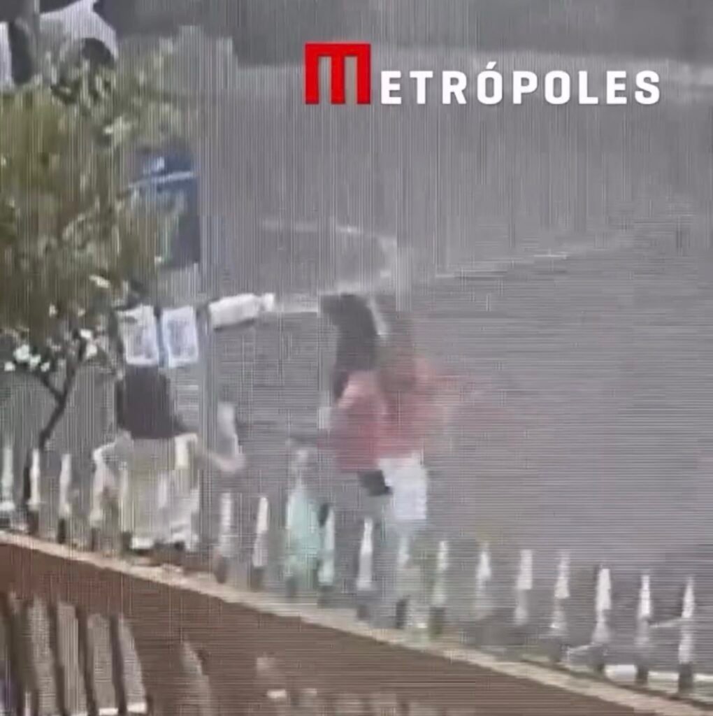 Vídeo flagra trio, com duas mulheres de vermelho, colando cartazes falsos de Celina Leão